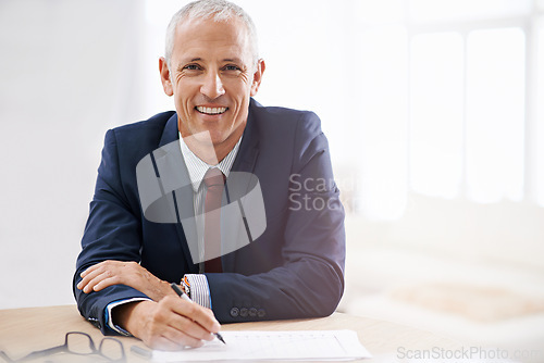 Image of Office, documents and portrait of business man with confidence for career, job and working at desk. Professional, startup agency and senior person writing notes for company pride, smile and planning