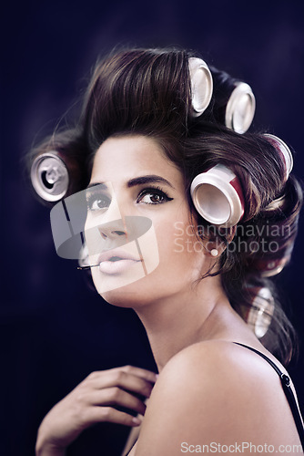 Image of Studio, rollers and haircare for woman with glamour, creative and curling with cans for soda on head. Adult, girl and female person with confidence of style, texture and model with aesthetic