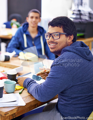 Image of Businessman, portrait and lunch by desk in office with happiness for eating break, pizza and coworking company. Programmer, employee and face with glasses, fast food and coding team at workspace