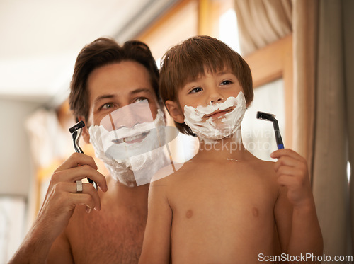 Image of Father, son and teaching for shave, bathroom and mentor with healthy hygiene or routine. Man, child and skincare for smile, growth or childhood development or bonding with razor and concentration