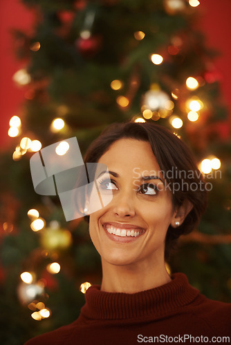 Image of Thinking, smile and Christmas with woman, home and ideas for festive season and planning for decorations. Person, apartment and lady with Xmas tree and celebration with joy and excited with holiday