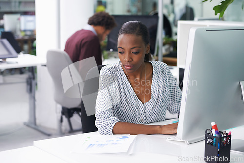 Image of Computer, research and documents with business black woman at desk in office for company administration. Email, feedback and report on pc with serious young employee in workplace for information