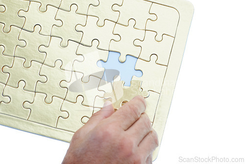 Image of Person, hands and puzzle with piece for problem solving, solution or building on a white studio background. Closeup of creative with jigsaw board for thinking, development or matching on mockup space
