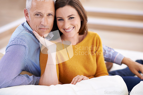 Image of Couple, age difference and smile for love in unique relationship, portrait and support for trust at home. Senior man, young woman and marriage, commitment and loyalty with partner and pride together