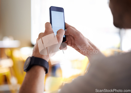 Image of Man, hands and typing with phone at cafe in social media, communication or networking at restaurant. Closeup of male person on mobile smartphone for online chatting, texting or message at coffee shop