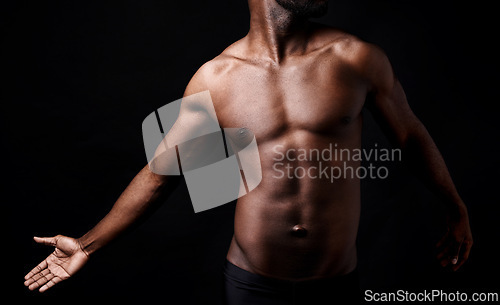 Image of Black man, fitness and muscle with shadow for exercise or workout on a dark studio background. Closeup of young African male person or bodybuilder with masculine or muscular figure on mockup space