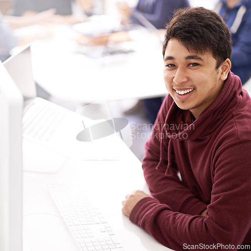 Image of Happy man, computer and portrait at office desk for web development, programming or information technology. Young programmer, worker or business designer on multimedia for startup project or planning