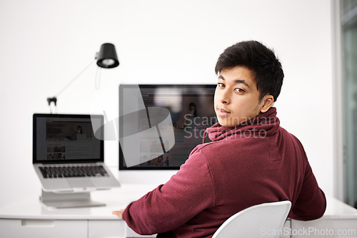Image of Business man, portrait and computer screen for web development, programming and information technology. Young programmer, worker or online designer on laptop or multimedia for startup project at desk