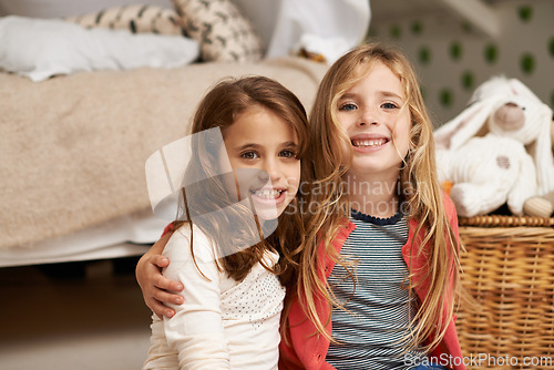 Image of Happy, hug and portrait of children in bedroom for relaxing, bonding and playing with toys in home. Night, friends and young girls on floor embrace for childhood, fun and happiness in house together