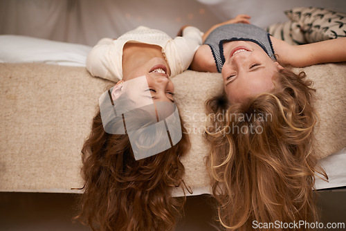 Image of Happy, sleepover and playful children in bedroom for playing, bonding and relaxing in home. Laugh, friends and young girls upside down on bed for childhood, fun and happiness for youth relationship