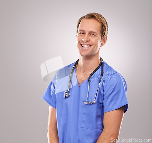 Image of Man, nurse and portrait in studio, healthcare expert and specialist on gray background. Happy male person, cardiologist and proud of career on mockup space, trustworthy physician and medicare health