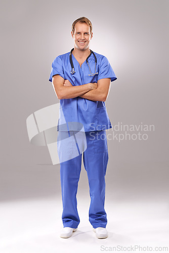 Image of Man, nurse and portrait in studio, confident expert and specialist on gray background. Happy male person, cardiologist and proud of medicare on mockup space, trustworthy physician and professional