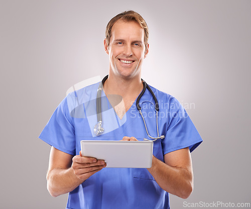 Image of Tablet, doctor and portrait of man in studio for medical research, insurance and report for hospital. Healthcare, clinic and worker on tech for consulting, telehealth and internet on gray background