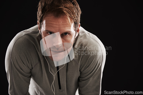Image of Portrait, tired and man with fitness, breathing and healthy athlete on a dark studio background. Face, person and model with wellness and exhausted with burnout and fatigue with exercise and workout