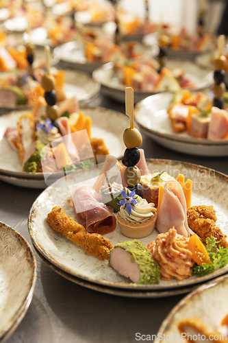 Image of Gourmet canap&eacute;s on decorated plates