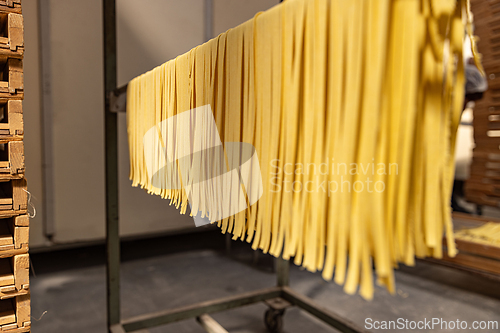 Image of Fresh pasta drying on racks