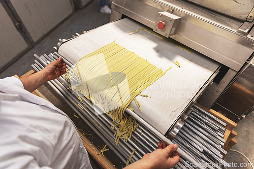 Image of Pasta through a roller machine