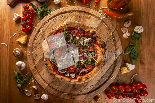 Image of Gourmet pizza with fresh toppings