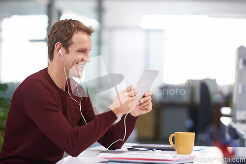 Image of Tablet, smile and businessman with earphones, watching at desk in office workplace. Happy, technology and business videos or social media streaming, elearning or internet research for online project