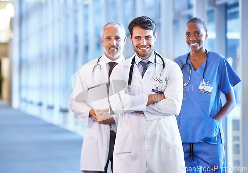 Image of Portrait, leader and smile of medical team in hospital for healthcare service in clinic. Confidence, happy nurse and diverse group of doctors in collaboration, cooperation or arms crossed together