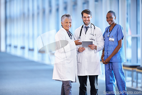 Image of Portrait, tablet and smile of medical group in hospital for healthcare service in clinic. Happy nurse, diverse team and doctors on technology for collaboration and cooperation of people together