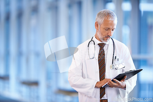 Image of Checklist, serious doctor and man reading in hospital for healthcare, wellness and notes. Clipboard, medical professional and mature surgeon with paperwork, results and report on chart in clinic