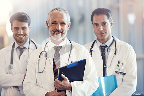 Image of Portrait, leader and happy team of doctors in hospital for healthcare service together. Face, smile and group of medical professionals in collaboration, cooperation or men with checklist in clinic