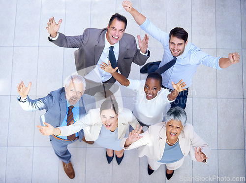 Image of Portrait, business people and happiness for good job, teamwork or collaboration together in office. Top view, winner and diversity group of employee workers for success, victory or celebration