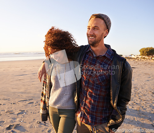 Image of Love, travel and happy couple at beach with hug, support or bonding on sunset walk in nature. Happy, care and people embrace at the ocean for sunrise journey, adventure or romance in Hawaii together