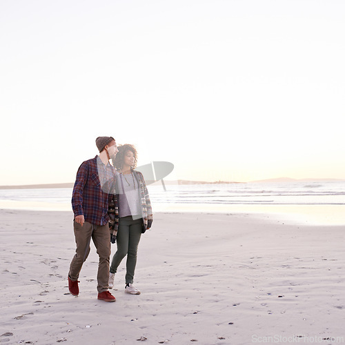 Image of Couple, beach and walking together in nature, happy calm people on vacation. Ocean, outdoor and partners in love with respect and care, date and romantic stroll for relax with seaside sunrise