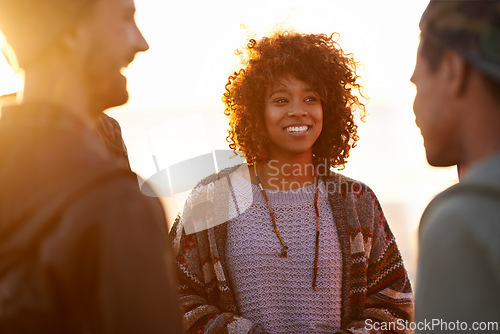 Image of Sunset, beach and happy friends in nature with conversation, travel or bonding outdoor. Sunrise, adventure and gen z group of people at sea with support, trust or communication on Hawaii vacation