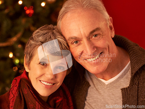 Image of Christmas, smile and portrait of senior couple, decorations and celebration with love and happiness. Grandparents, retirement or face on Christian holiday, affection or elderly man and wife in home