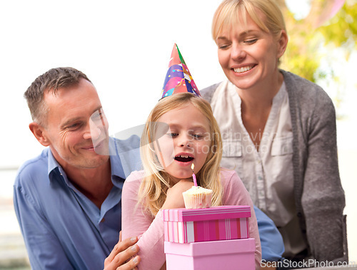 Image of Child, blow or candle for happy birthday, party or cake as fun wish, family or bonding together. Papa, mama or girl or smile at celebration, congratulations or childhood growth and development