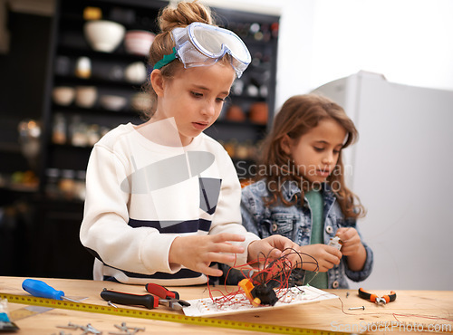 Image of Child, play and tools for robotics, construction and design for busy and bonding for childhood game. Kids or friend for sibling with wire and tape for crafts, diy or fun indoor for tasks and cute