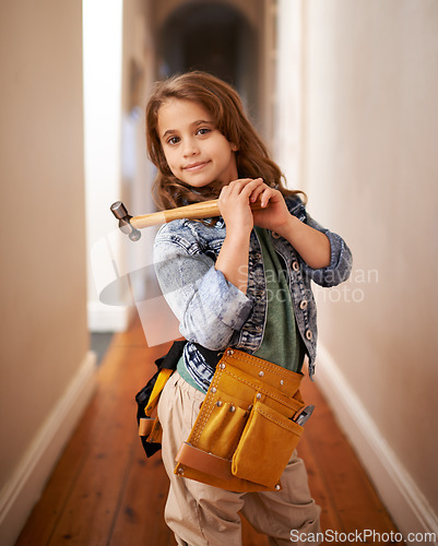 Image of Child, portrait and ready for construction with hammer, play and artisan game in home. Female person, tool and equipment for remodeling project on weekend, carpentry and woodworking role play