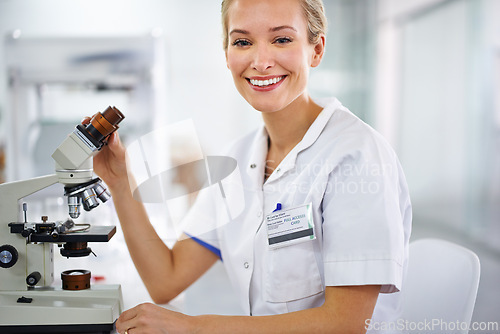 Image of Smile, microscope or portrait of scientist or woman in laboratory for research, medical analysis or test. Proud, investigation or happy science expert with solution for future development or results