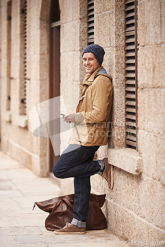 Image of Man, waiting and travel in city with taxi for morning commute or transportation for vacation on holiday. Luggage, bag and person with journey to work or search phone online for cab to airport