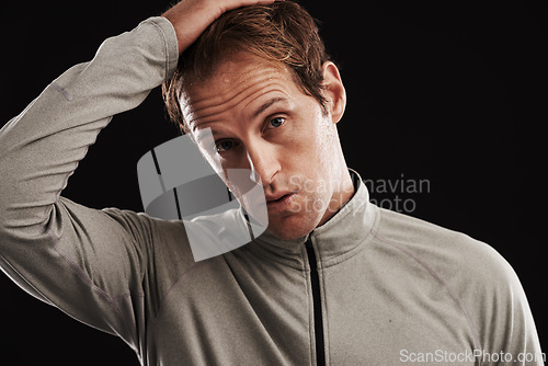 Image of Portrait, tired and man with fitness, fatigue and healthy athlete on a dark studio background. Face, person and model with confidence and exhausted with burnout and breathing with exercise or workout