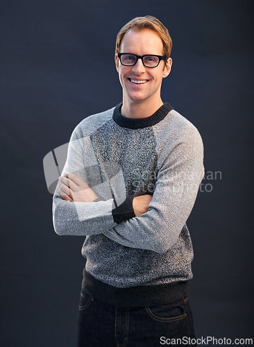 Image of Happy, nerd and portrait of man in studio with arms crossed and pride on dark background. Confident, programmer and person with a smile in development of solution for IT project in mockup space