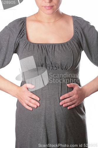 Image of expectant mother in knitted dress