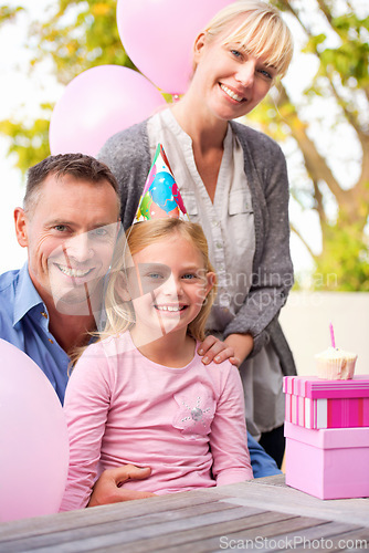 Image of Portrait, family or gift at happy birthday, party or balloon as love, bonding or together outside. Papa, mama or girl as smile at box, hug or celebration of gratitude, congratulations or childhood