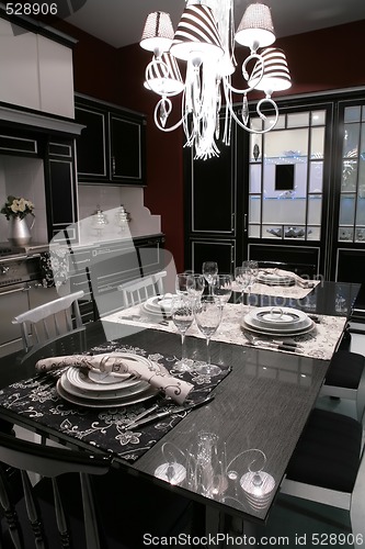 Image of modern dinning-room with served table