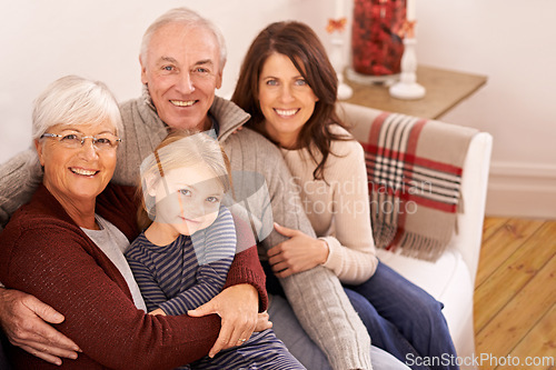 Image of Grandparents, parents and kid on couch for portrait with hug, care or love with generations for bonding in home. Mother, father and senior people with child for embrace on lounge sofa in family house