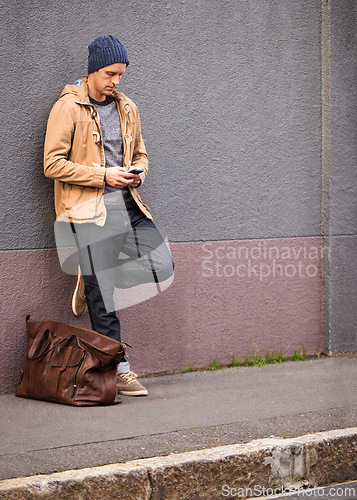Image of Man, waiting and travel with taxi from phone in city for morning transportation for vacation or holiday. Luggage, bag and person with journey to work or search smartphone online for cab to airport