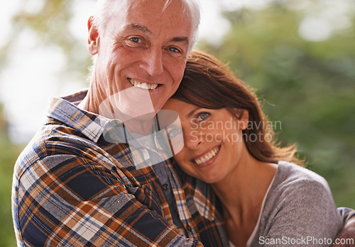 Image of Senior couple, happy and portrait for hug, love or outdoor in nature with connection for retirement. Woman, elderly man and embrace on patio with pride, care or smile in backyard by trees in Germany