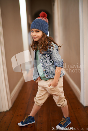 Image of Girl, portrait and child with fashion in home with pride and happiness in clothes for winter. Kid, smile or relax in house with beanie, jacket or casual style on holiday or vacation in Finland