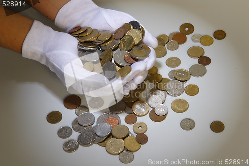 Image of coins in hands