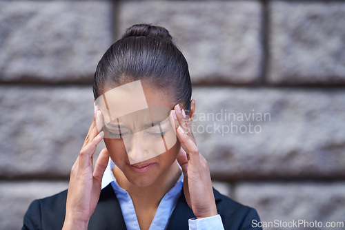 Image of Stress, lawyer and woman with headache in city for legal justice, travel and crisis with burnout or head pain. Wall, anxiety or face of a female attorney, advocate or corporate advisor with migraine