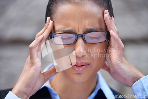 Image of Business, face and woman with headache in city for legal justice, travel or crisis with burnout or head pain. Wall, anxiety or stress with female attorney, advocate or corporate advisor with migraine