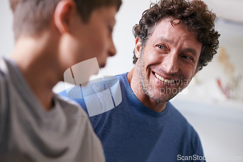 Image of Home, son and father with smile, happiness and proud of child, growth and development of boy. House, adult and man listening to kid talk as parent with love, support and care for family in apartment